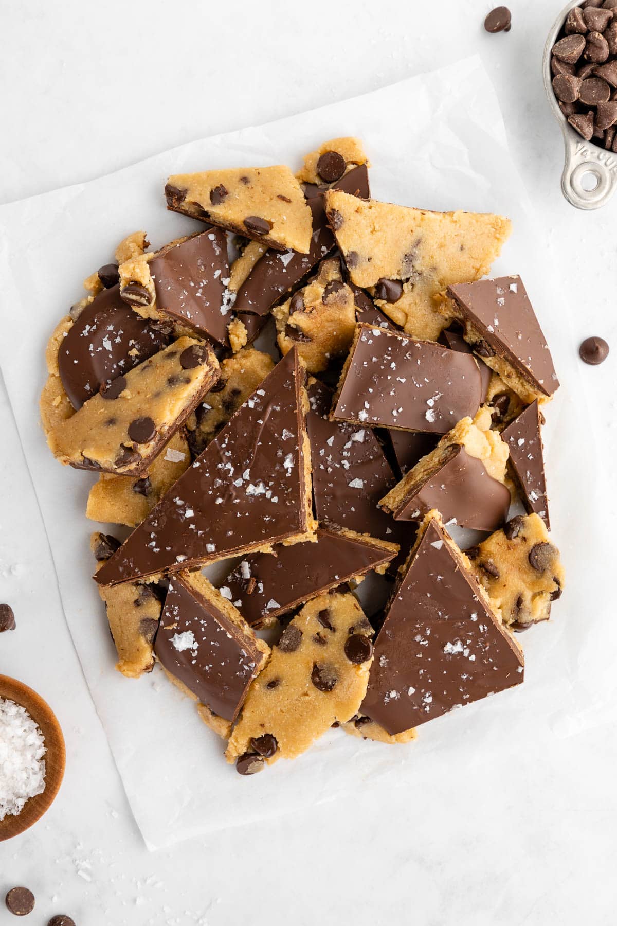 a pile of healthy cookie dough bark pieces with almond flour, maple syrup, and coconut oil